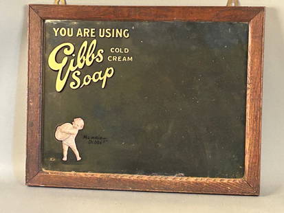 Gibbs Soap Cold Cream Advertising Mirror: Gibbs Soap Cold Cream advertising mirror with baby holding giant bar of soap. Gold and black lettering, original oak frame 17 1/2 x 22 1/4.Provenance: Robert and Jane Cottingham Collection Newtown, CT