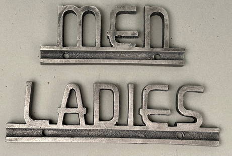 Men and Ladies Signs: "Men" and "Ladies" signs. Two signs denoting men's and ladies restrooms? or any other use you choose. Ladies 8.5" x 2'5". Men 5.75" x 2.5"Provenance: Robert and Jane Cottingham Collection Newtown, CT