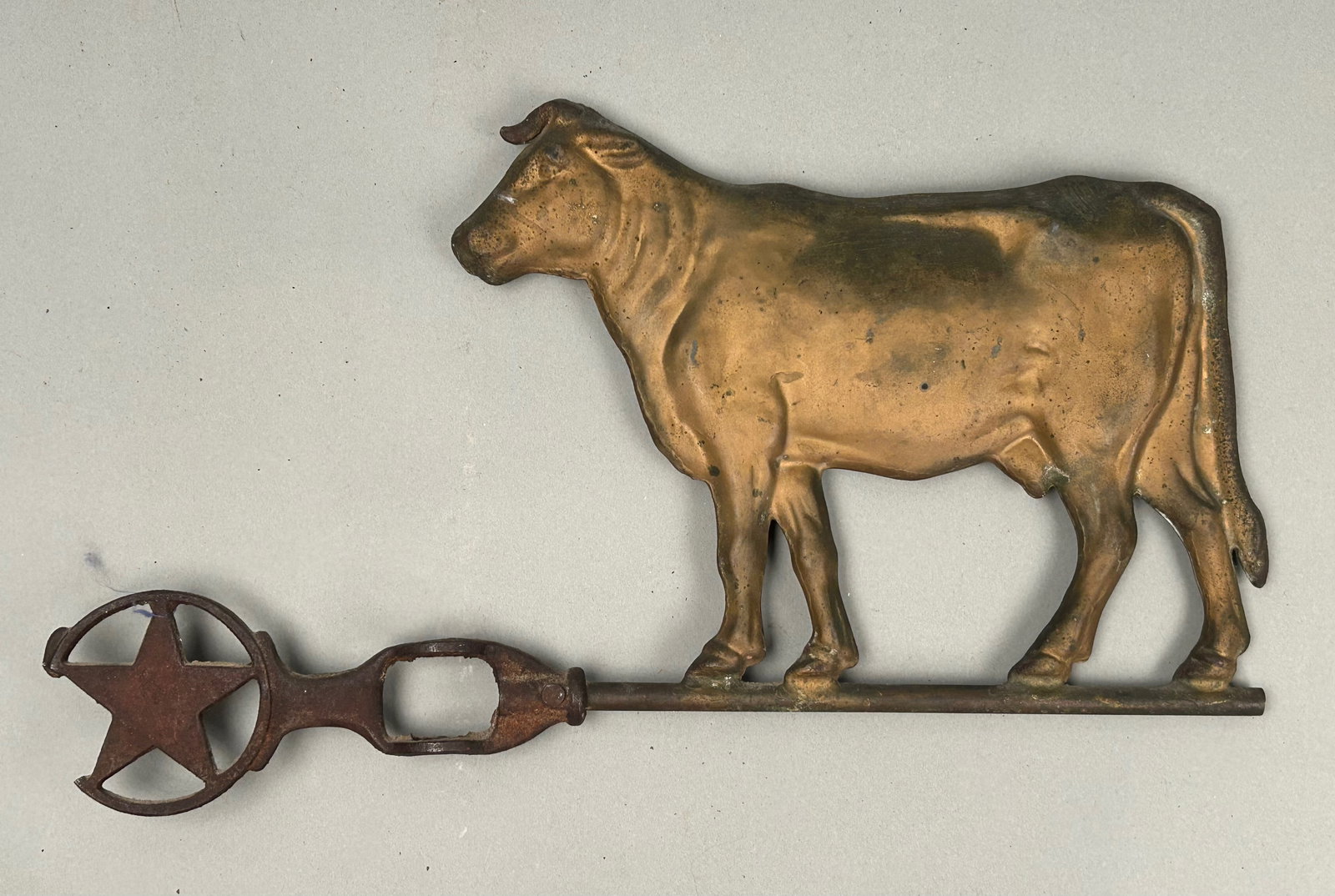 Cow Weathervane with Star: Cow weathervane. Small cow on iron bracket with star. Original gold surface.16 1/2 x 10.Provenance: Robert and Jane Cottingham Collection Newtown, CT