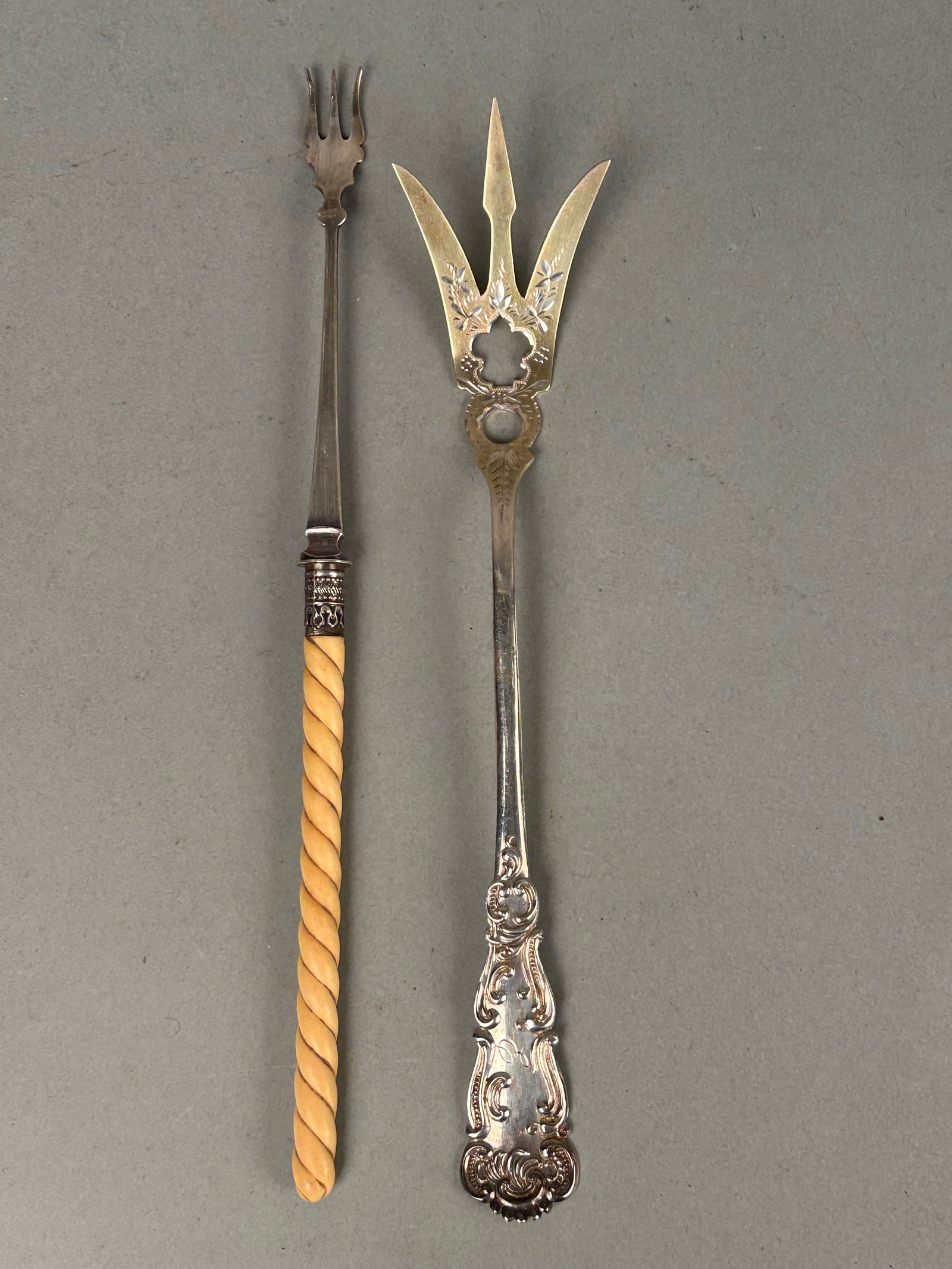 2 Sterling Silver Serving Forks: 2 sterling silver serving forks. One hallmarked with bone handle 9 1/4” the second Marked Sterling 8 3/4”.total weight 59g