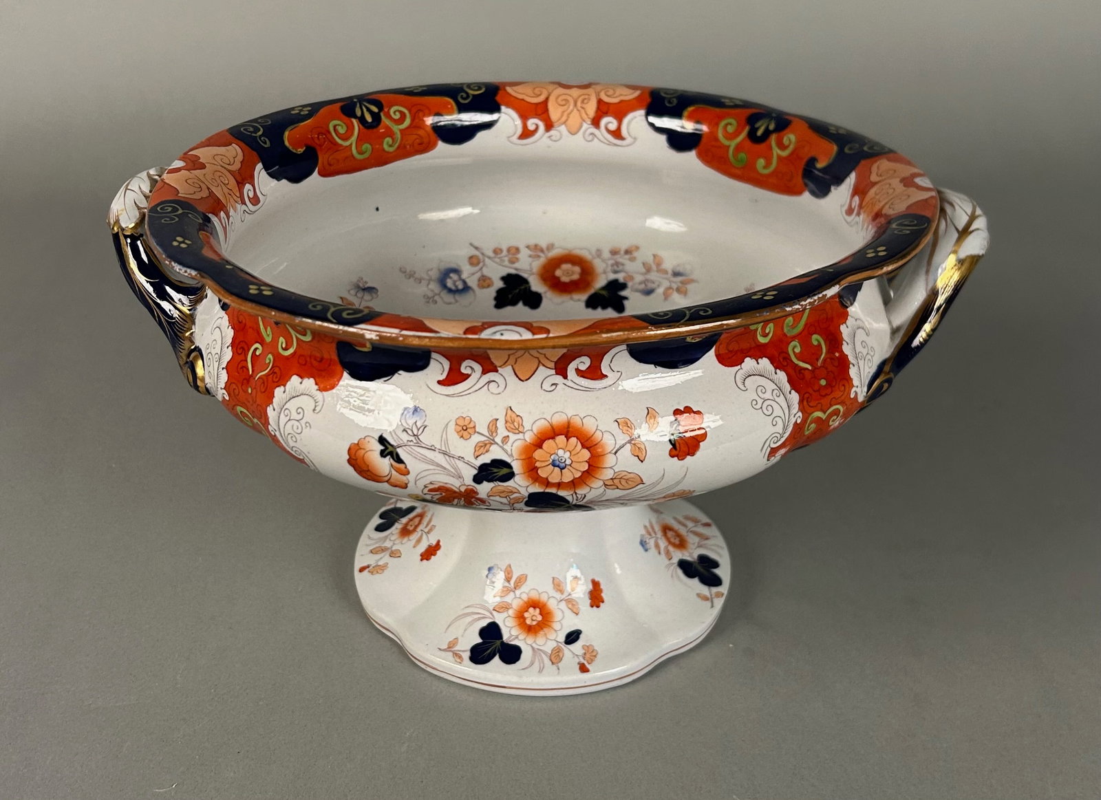 Imari ironstone footed fruit bowl: Imari ironstone footed fruit bowl. With English ironstone mark on base lion unicorn and crown. ?Ironstone China? footed bowl with candles. Nine and three-quarter inch diameter by 6 1/4 inch tall.
