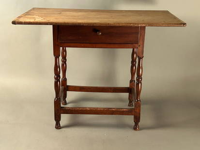 18th c William and Mary Tavern Table: 18th century William and Mary Tavern table finely turned legs, stretcher base, single drawer. Scrubbed top. Feet original. 38? x 25? x 27? refinished, original red painted surface on underside of top.