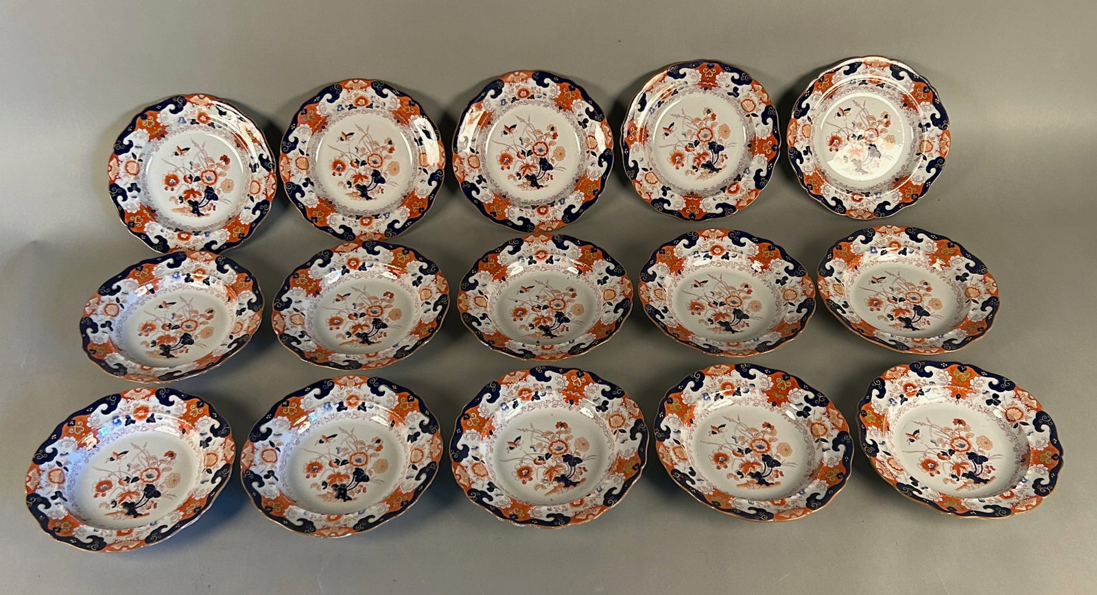 Set 15 Imari ironstone Soup Bowls: Set 15 Imari ironstone Super Bowls with English lion and unicorn and crown mark on reverse “ironstone China” 10 1/2 inch diameter. Age-appropriate wear microchips to two bowls.