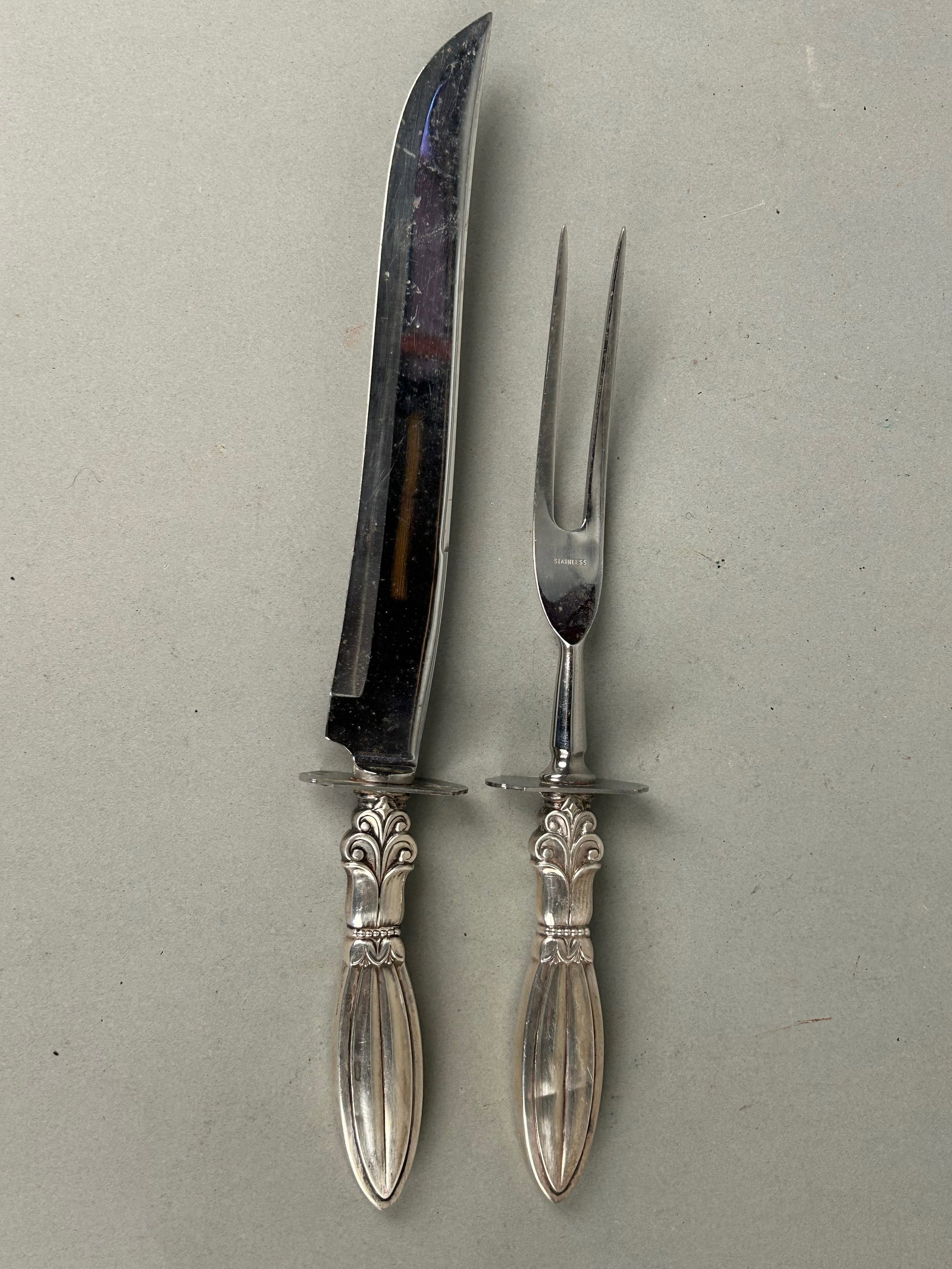 Sterling Silver Carving Knife and Fork: Sterling silver carving knife and fork. Marked W(Whiting) both with Sterling weighted handles knife 13 1/2 fork 11 1/4. Total weight 290g