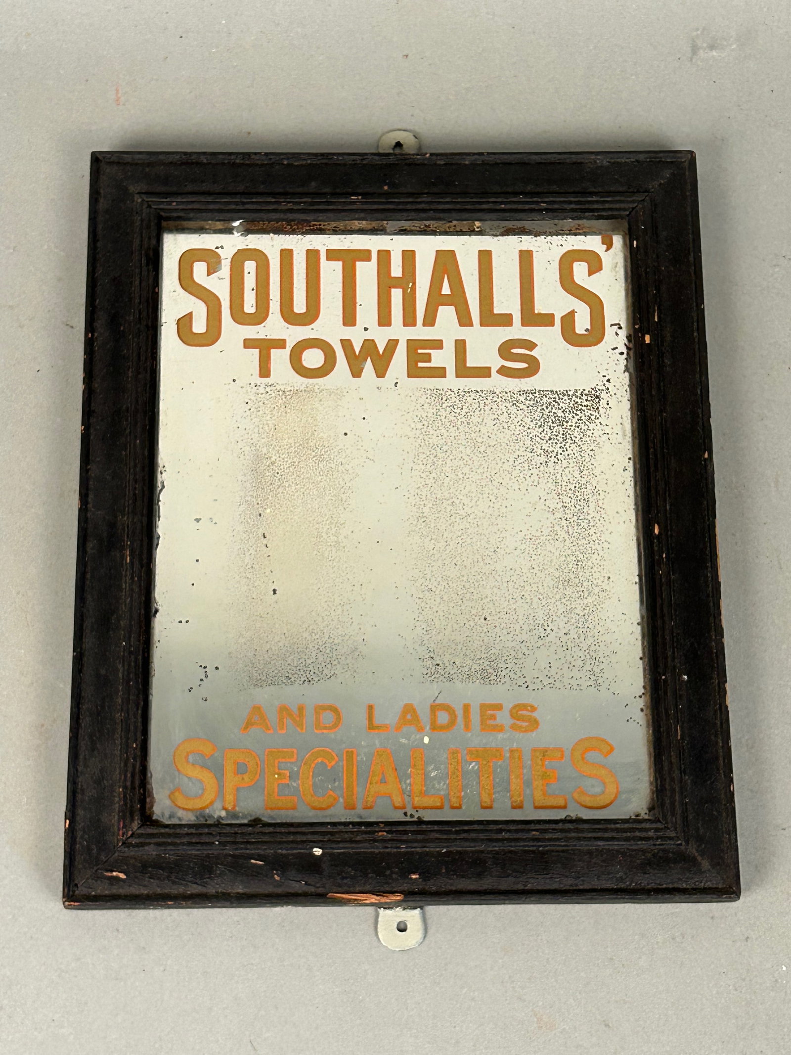 Southalls' Towels Antique Reverse Painted Glss Sign: Southalls' towels antique sign, reverse painted glass. Southall’s towels and ladies specialties. Original wooden frame 10 3/4” by 8 3/4” Provenance: Robert and Jane Cottingham Collection