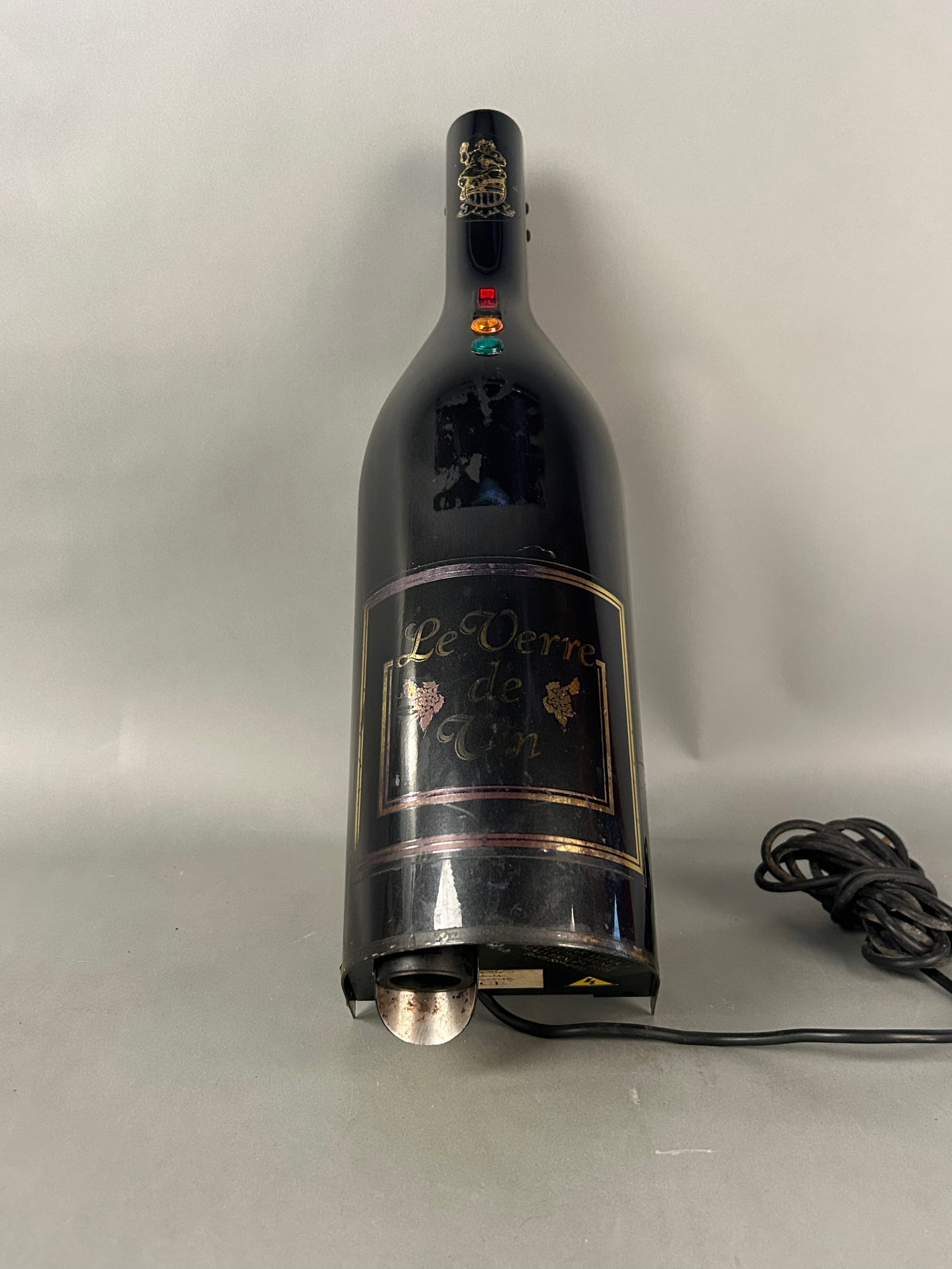 Wine and Champagne Preserver Bottle-Good News Cafe: Electric Wine Preserver BottleWine and champagne preserver formed as a wine bottle labeled “Le Verre de Vin,” with applied grapevine motif and jewel accents. Designed to help preserve opened w