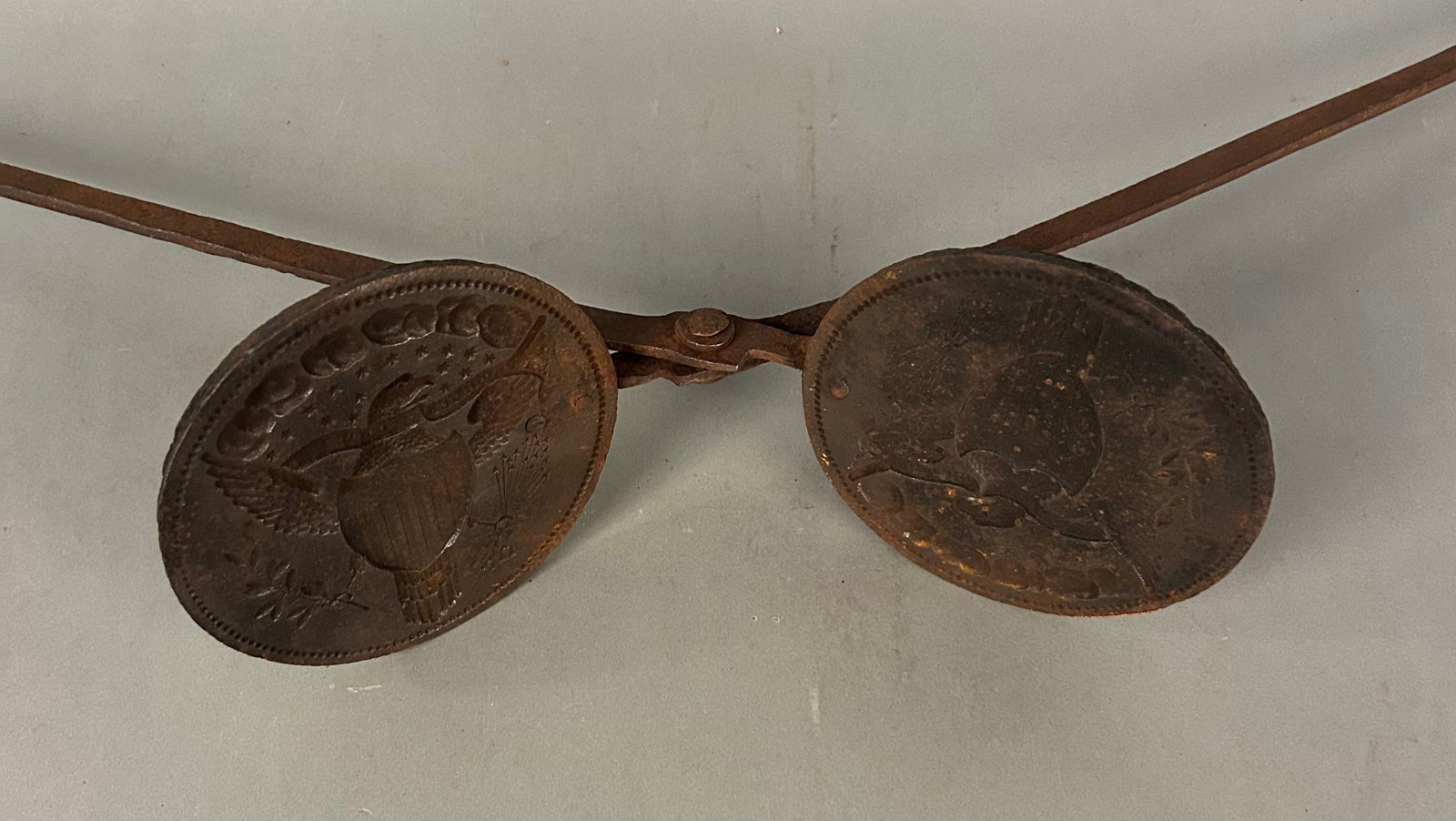 Rare American Eagle Waffle Iron: Rare American Eagle Waffle Iron, late 18th–early 19th century. Heavy cast iron plates boldly molded with a Federal eagle and shield, stars above, and foliate devices; long wrought iron handles with