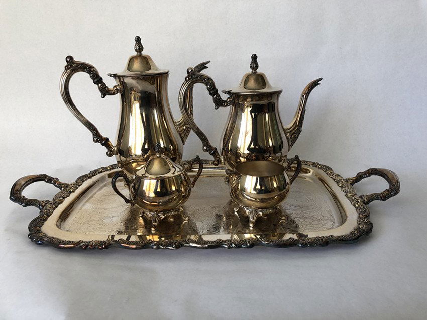 European silver tea set 5 pieces: European silver tea set 5 piecesTray length 24 inches wide 13 1/4 inchesTeapot Height 9 inches Width 10 inches x2Small teapot high 4 3/inch wide 6 inches wideMilk jug 3 inches high and 5 inches wide