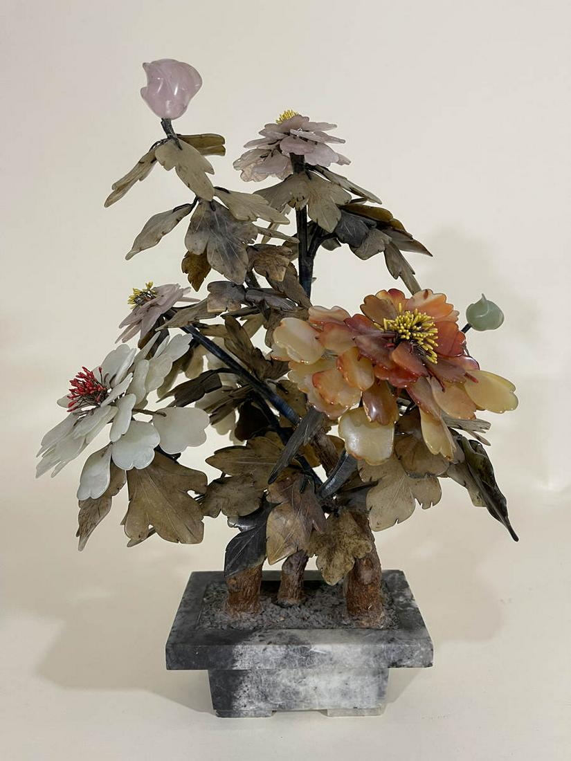 Chinese jade flower bonsai: Chinese jade flower bonsai, in the shape of peony flower, is composed of Hetian white jade, agate, Hetian jasper, Hetian sapphire and crystal, and the base is granite. Total weight is about 8 pounds.