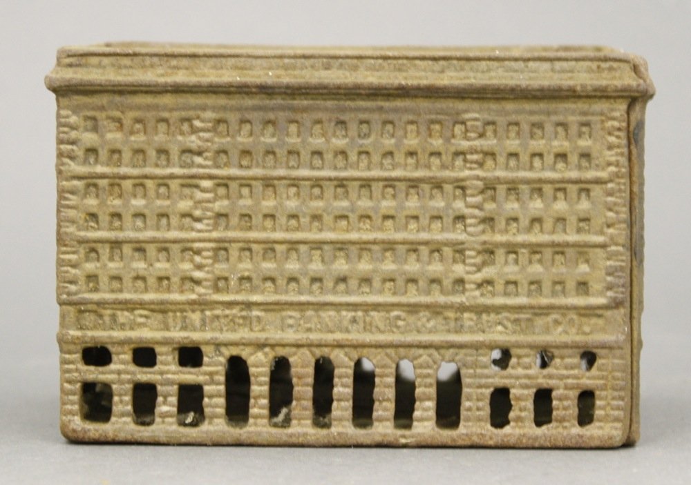 The United Banking & Trust Co.: Made by A. C. Williams. Cast Iron. 2 3/4" H x 4 1/4" L. Fine Condition. (Needs a Clean)