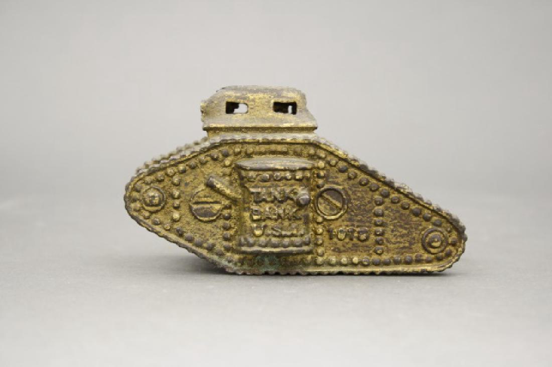 U. S. Tank Bank 1918: Made by A. C. Williams. Cast Iron. 4 1/4" L. Poor Condition. Cannon Broken and Missing.