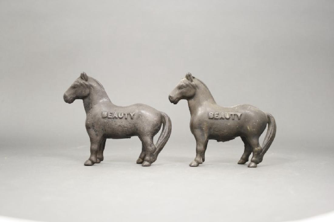 Lot: Two Beauty Banks: Made by Arcade. Cast Iron. 5" L. Fair Condition.