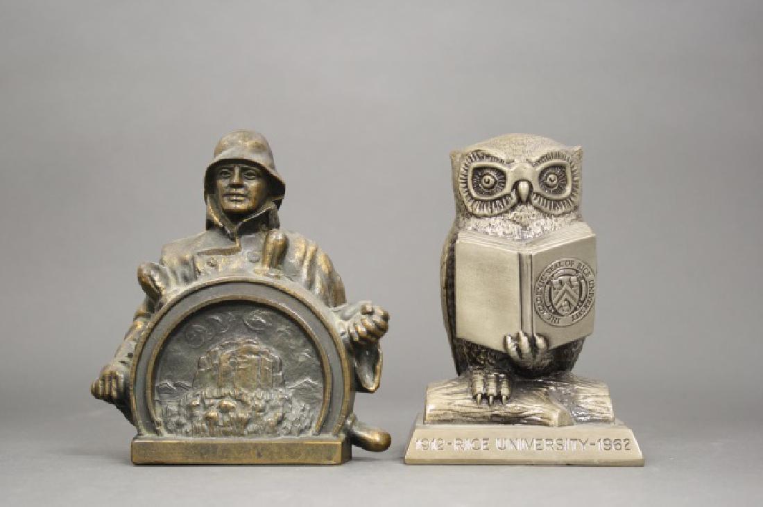 Lot: Two Still Banks: Ship Captain, Advertising Pilot Life Insurance Company (5 1/2" H) and Rice University Owl (5 1/4" H). White Metal. Excellent Condition.
