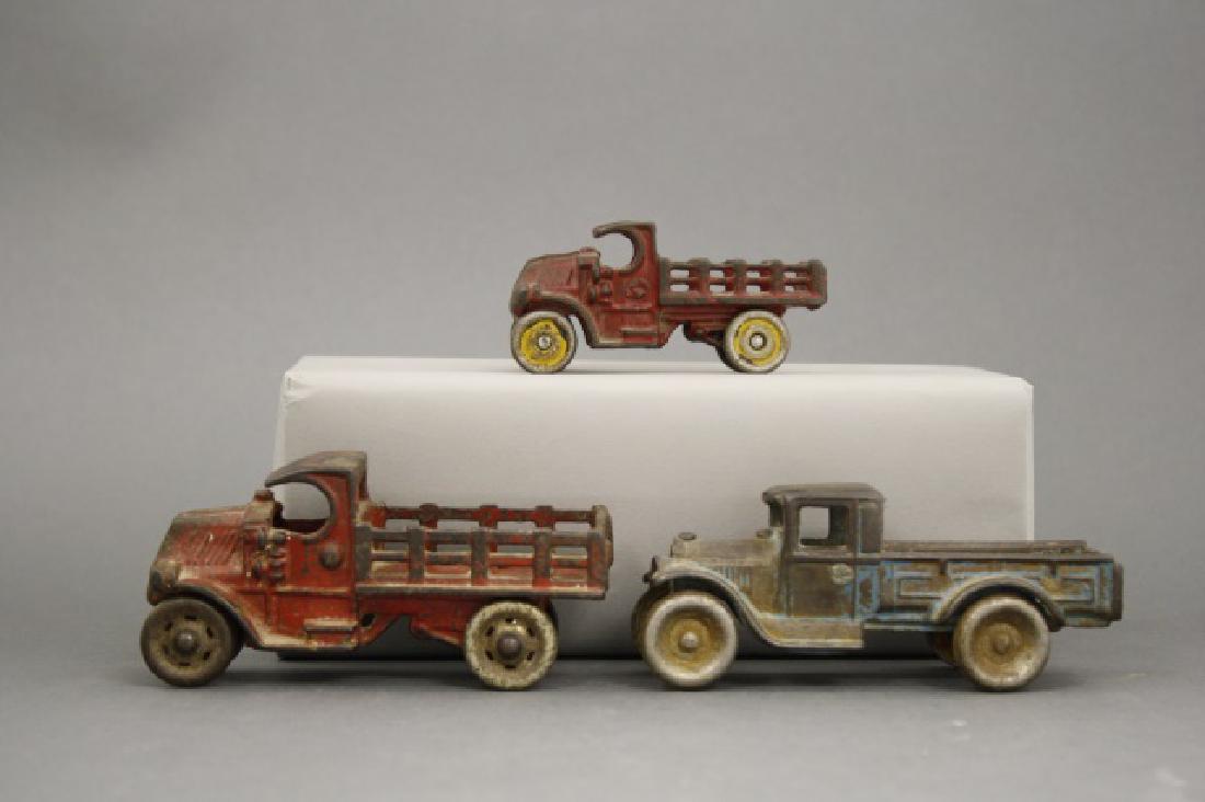 Lot: Three Flatbed Trucks (1 of 1)