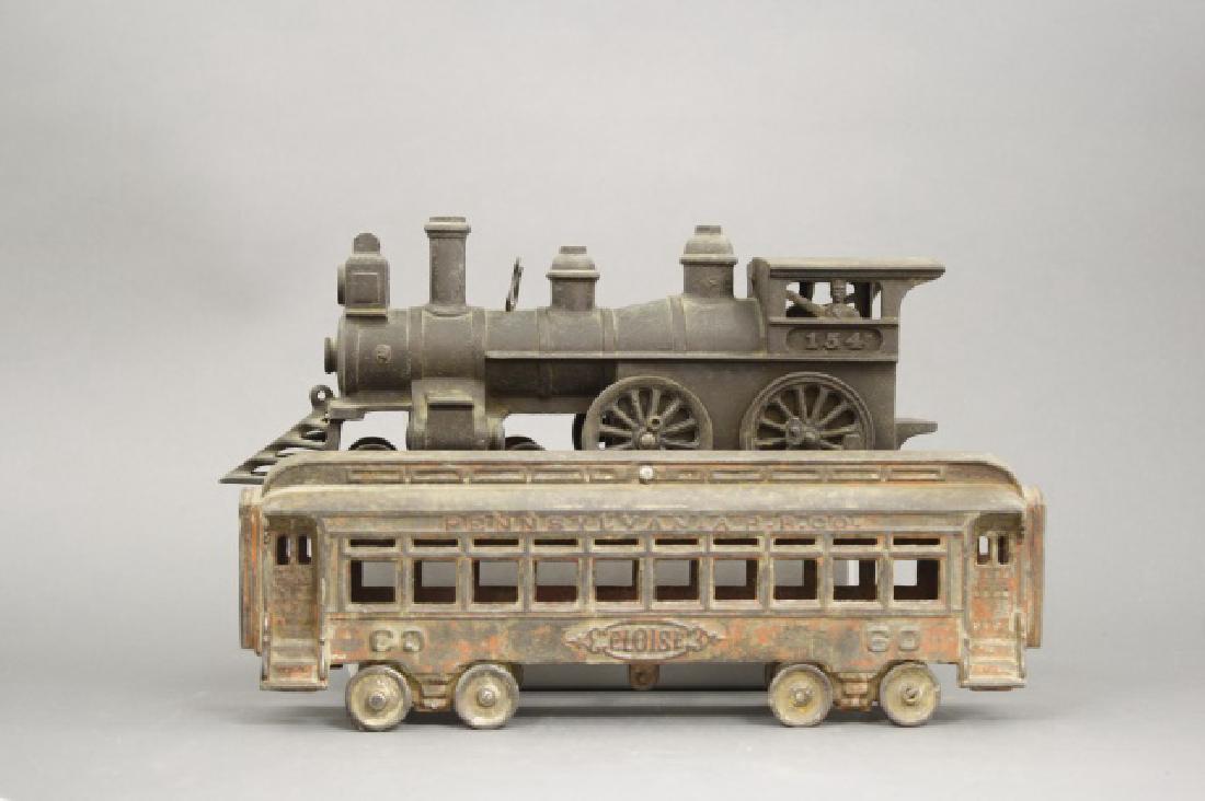 Locomotive and Passenger Car: Made by Ideal circa 1895. Cast Iron. 24" Long. Fair Condition.