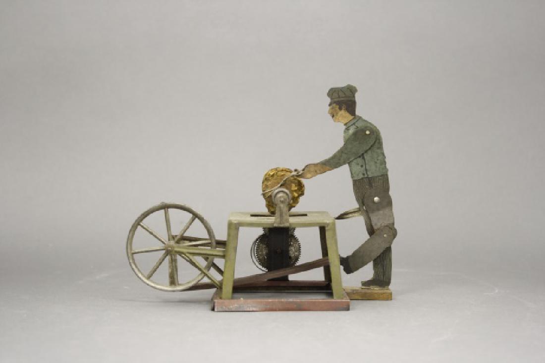 Man at Scissor Sharpener Windup Toy (1 of 2)