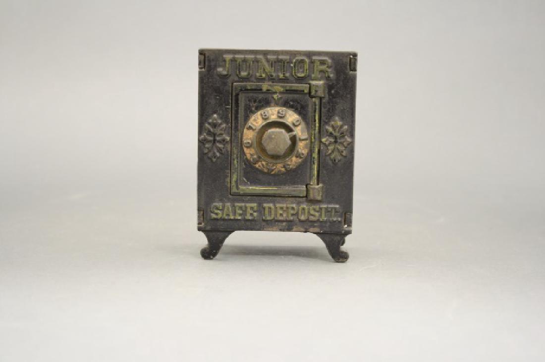 Junior Safe Deposit: Made by Kenton Hardware circa 1895. 4 1/2" H. Cast Iron and Tin. Very Good Condition.