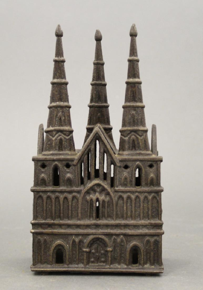 Litchfield Cathedral: Made by Chamberlain & Hill of England circa 1900's. Cast Iron. 6 1/2" H. Very Fine Condition.