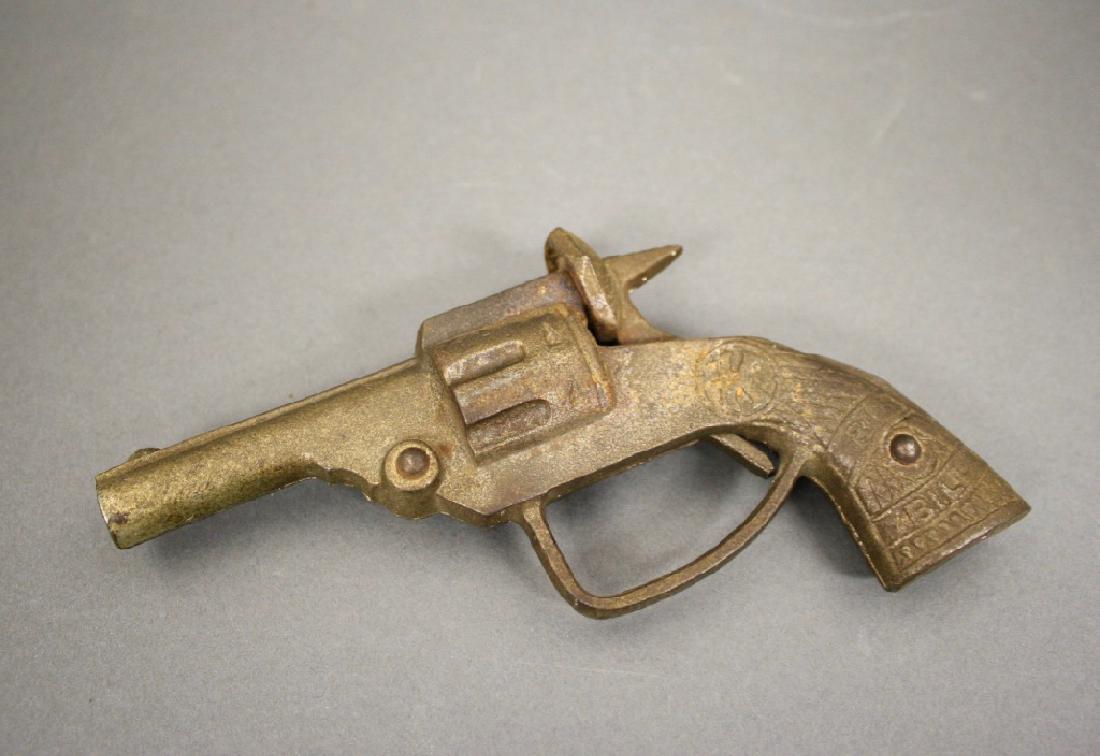 "Big Bill" Cap Gun: American circa 1915. Cast Iron. 5 3/4" L. Good Condition.