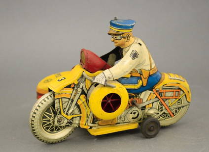 Motorcycle & Sidecar: Made by Louis Marx Company circa 1950. Tin. 8 1/4" L. Very Fine Condition. Works well.