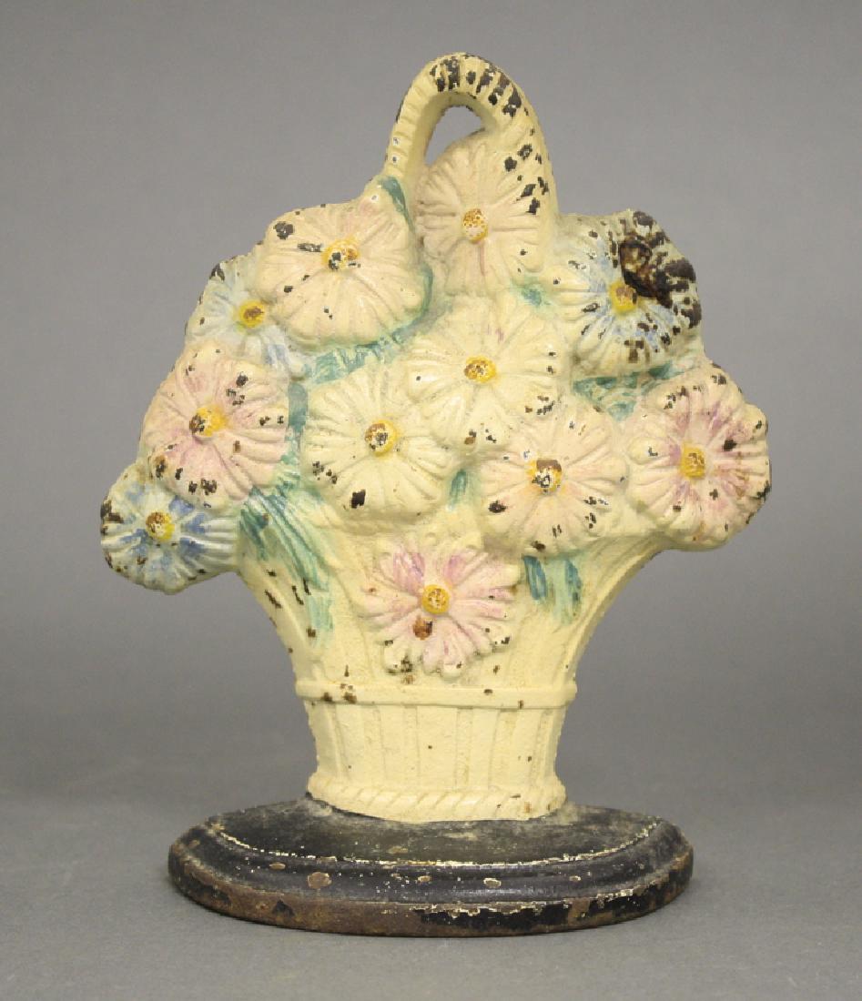 Basket of Flowers Doorstop: Made of Cast Iron. Fine Condition.
