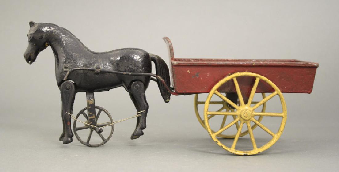 Ives Daisy Cart: Made of Cast Iron. 10 1/2" L. An old repaint.