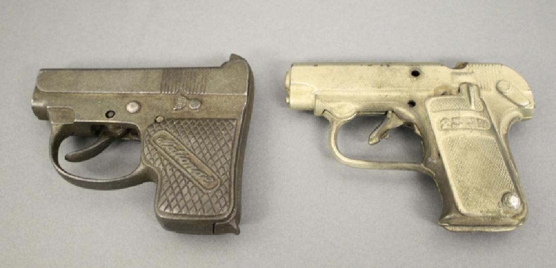 Lot: National and 25 Junior Cap Guns: Made of Cast Iron. 4" L. Fine to Excellent Condition.