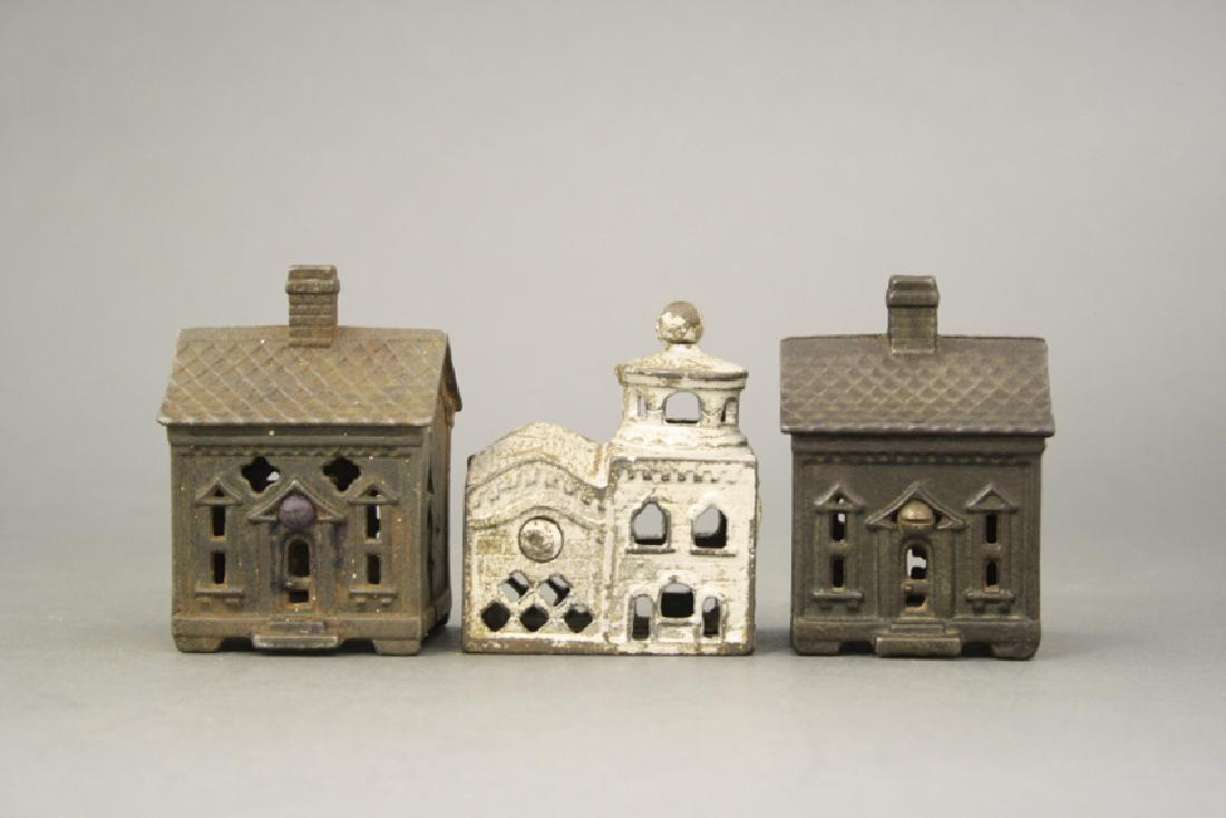 Lot: Three Cast Iron Still Building Banks (1 of 2)