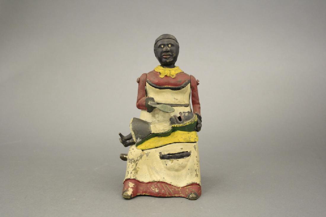 Mammy with Child Bank: Kyser & Rex. This example is made of brass. It is part of an old estate that assembled in the 1950's/60's. To our knowledge, no Mammy Bank has ever been reproduced. This is a conundrum. Very Fine Pain