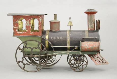 "Union" Clockwork Train: Ives, Blakeslee Company. Made of Tin. American - Circa 1885. 12.5" L. This is an impressive and colorful clockwork train engine. Ives, Blakeslee was considered the preeminent manufacturer of American