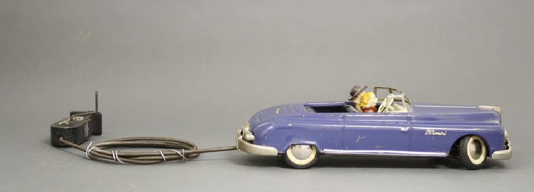 Primal Convertible: Made by Arnold, Western Germany, circa 1955. Made of Tin. 9.75" Long. Very Fine Condition.