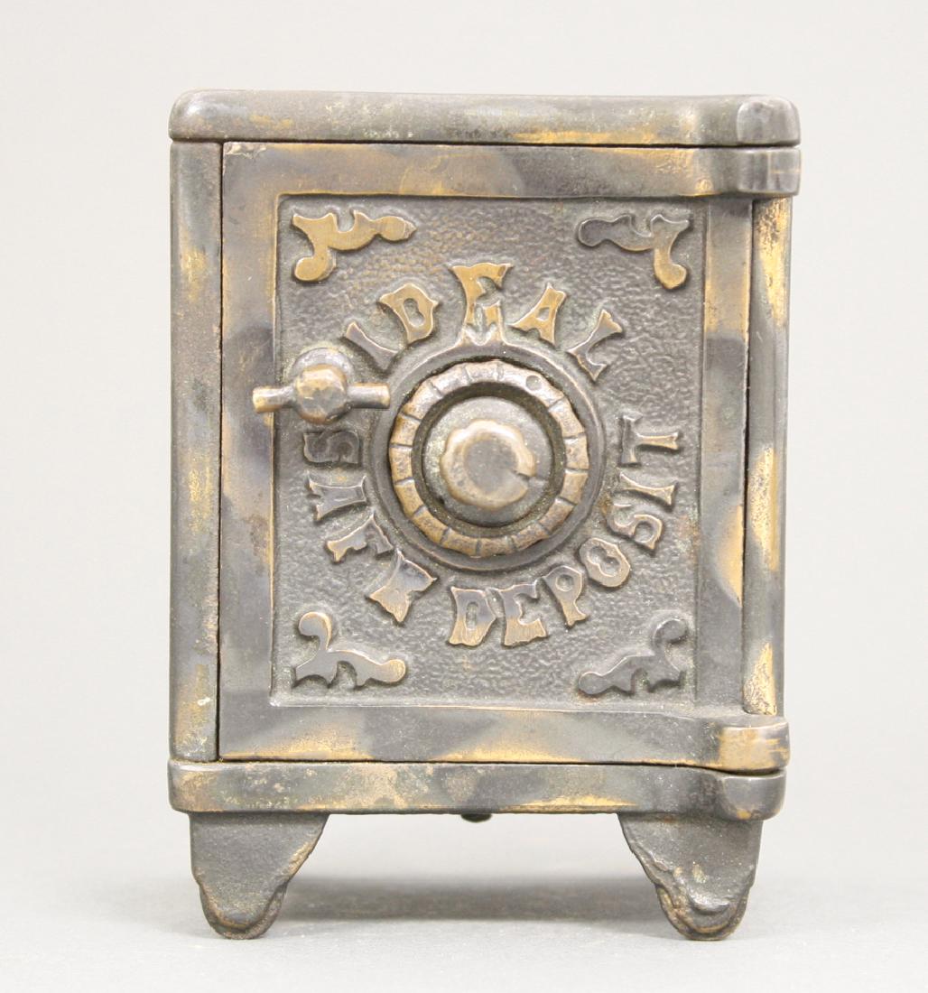 Ideal Safe Deposit: American - Circa 1895. 4.25" H. A great electroplated example. Made of Cast Iron. Excellent Condition.