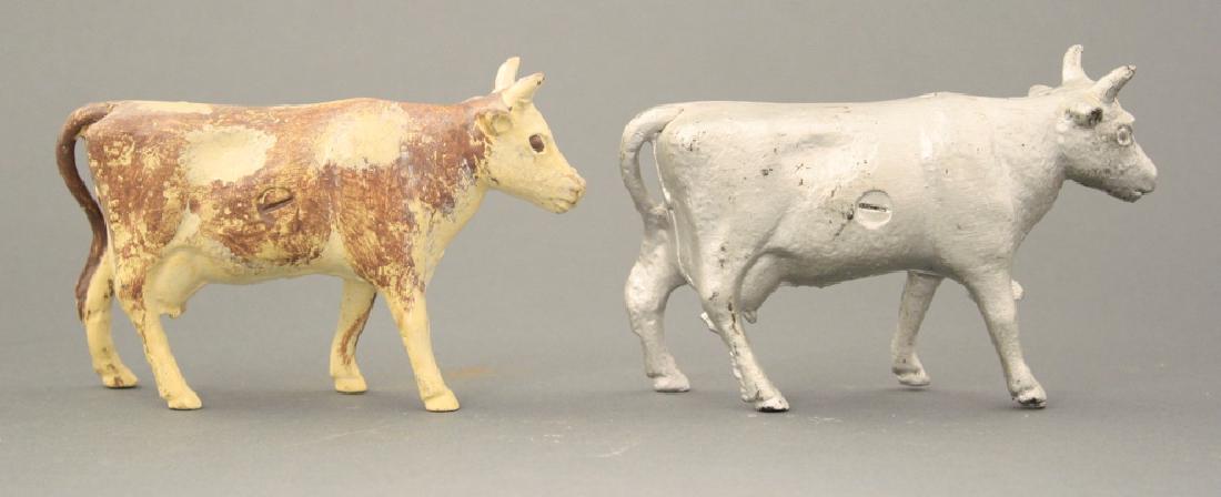 Two Cows: A. C. Williams circa 1920's. Made of Cast Iron. Both Repainted.