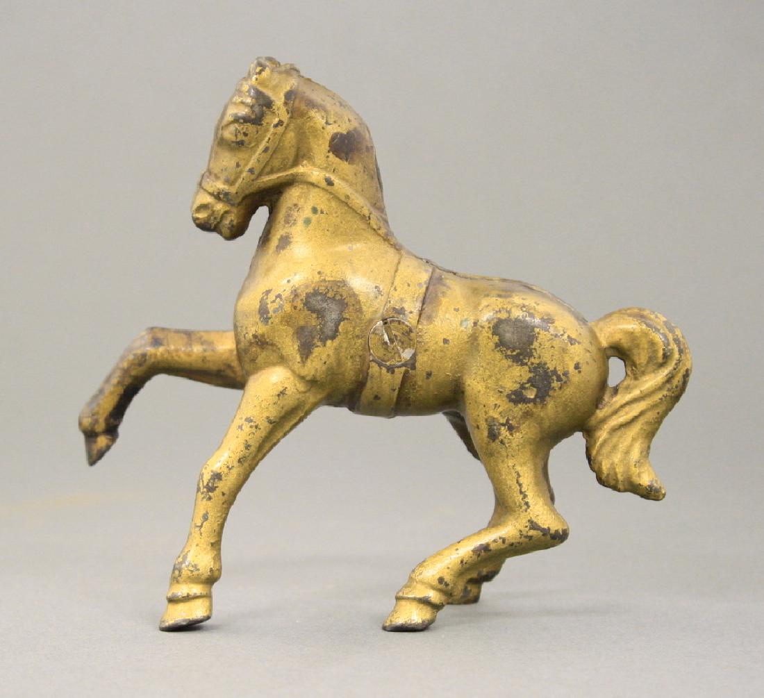 Horse with Belly Band: American - Circa 1910. Made of Cast Iron. Very Good Condition.