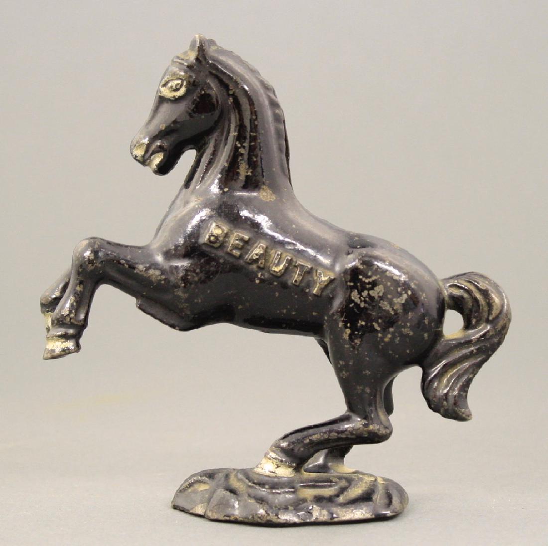 Beauty on Oval Base: A. C. Williams circa 1920's. Made of Cast Iron. Very Fine Condition.