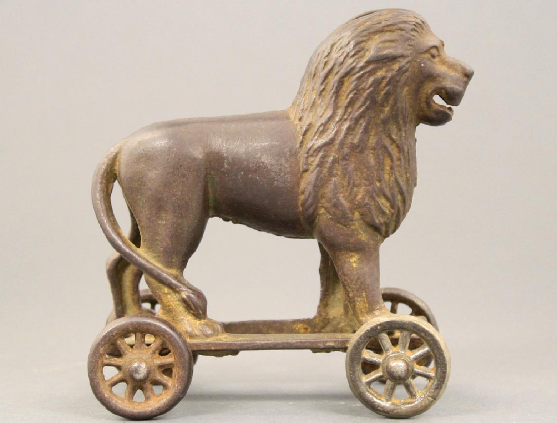 Lion on Wheels: A. C. Williams circa 1920's. Made of Cast Iron. Fair Condition.