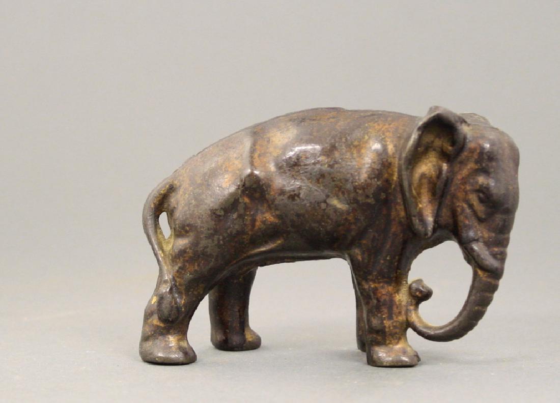 Elephant with Tucked Trunk: Arcade Mfg. Co. circa 1910's. Made of Cast Iron. Fine Condition.