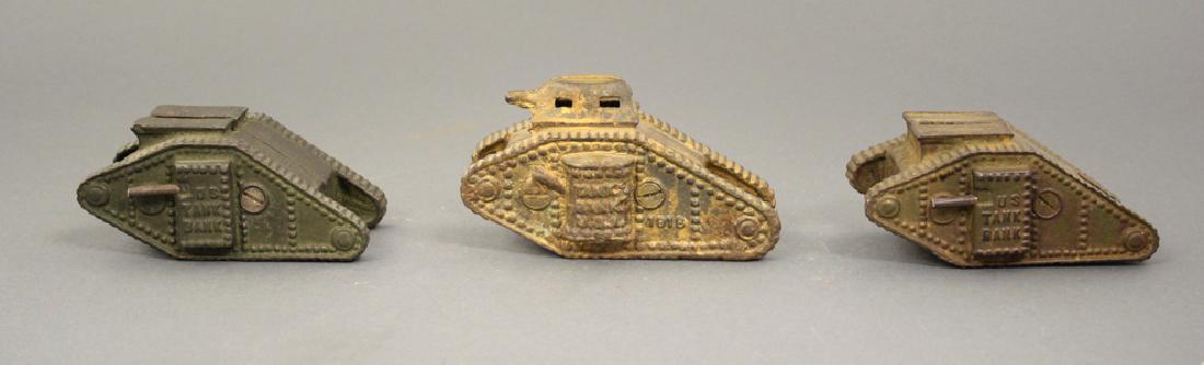 Three Tanks: American circa 1920's. Made of Cast Iron. Good Condition.