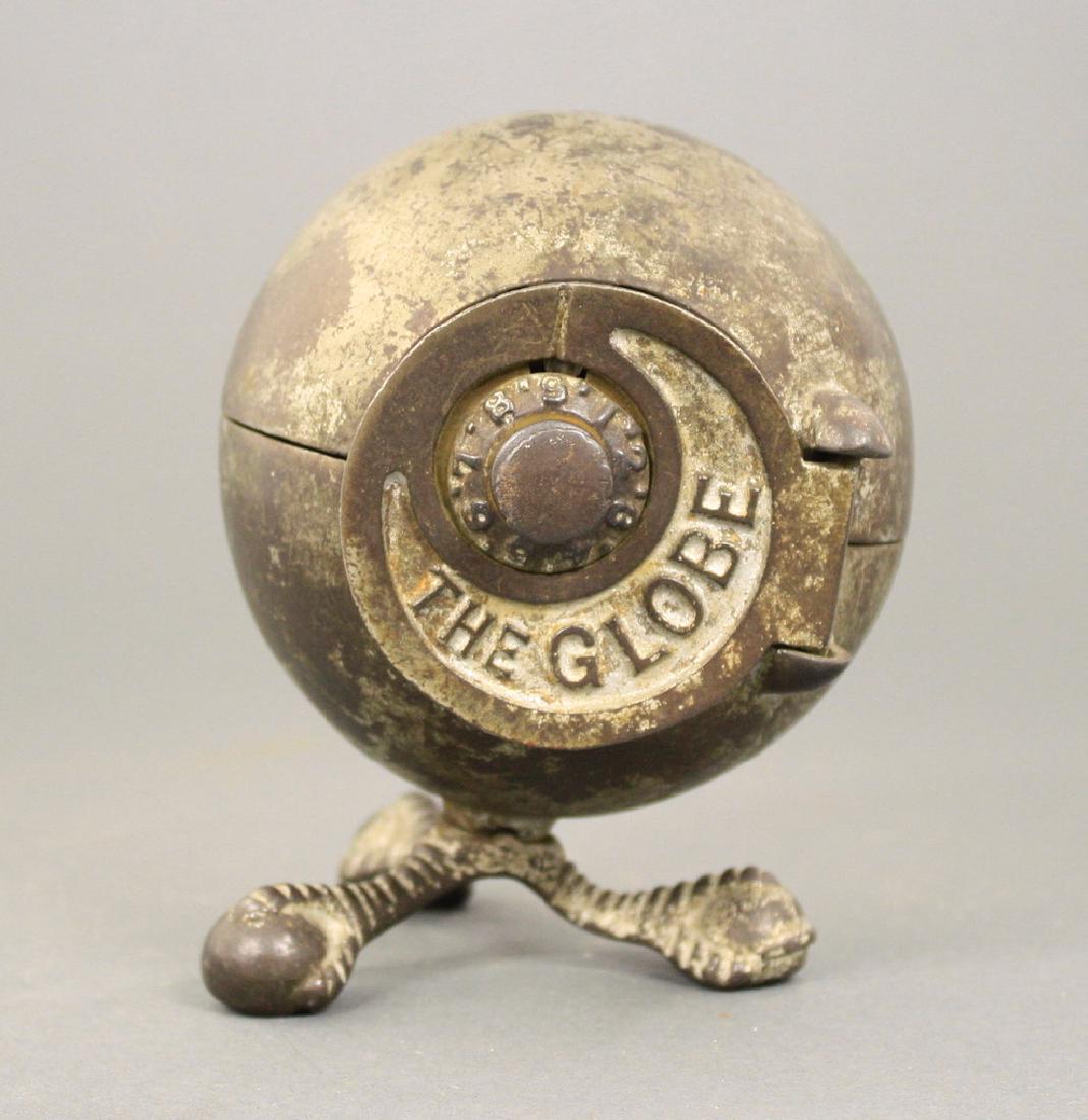 The Globe: Kenton Hardware circa 1910's. 5 3/8" H. Made of Cast Iron. Good Condition.