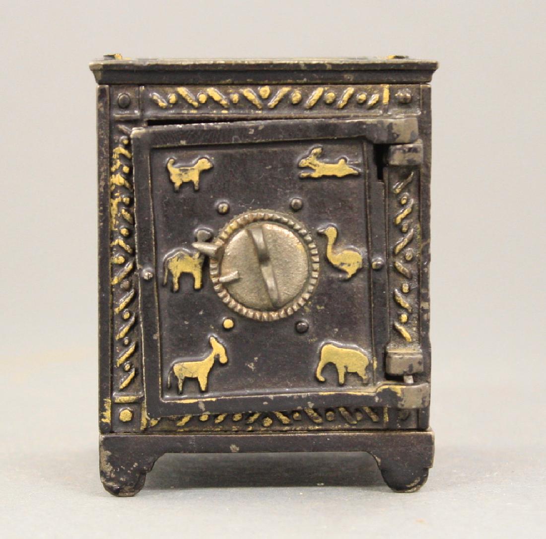 Animal Safe: American circa 1910. 3" H. Made of Cast Iron. Fine Paint Condition (Does not lock, nickel size rust spot on back panel).