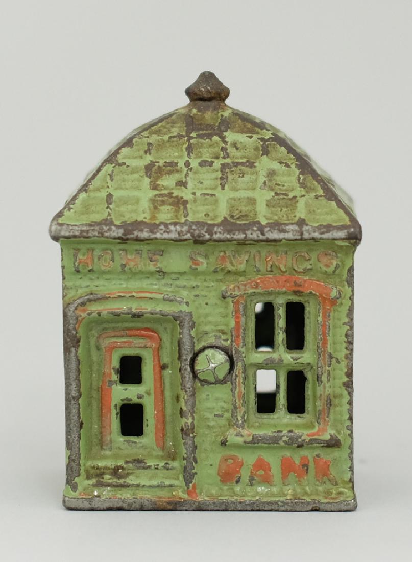 Home Savings Bank: Made by J. & E. Stevens circa 1890's. Made of Cast Iron. 3 1/2" Tall. Very Fine Condition (Replaced Twistpin).