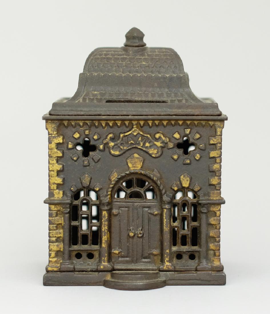 Roof Bank: Made by J. & E. Stevens circa 1880's. Made of Cast Iron. 5 1/4" Tall. Very Fine Condition.