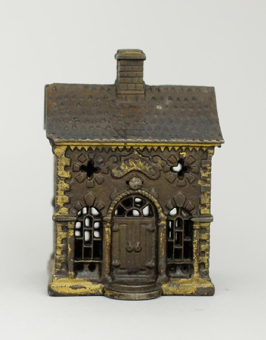 Roof Bank: Made by Grey Iron Casting Co. Circa 1900's. Made of Cast Iron. 5 1/4" Tall. Excellent Condition.