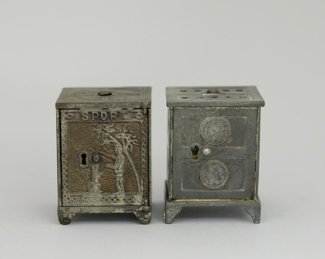 Sport Safe / Liberty Dime Safe: Made by Kyser & Rex circa 1880's. Both Cast Iron. 3" - 4 3/8" Tall. One in Good Condition, one in Very Fine Condition.