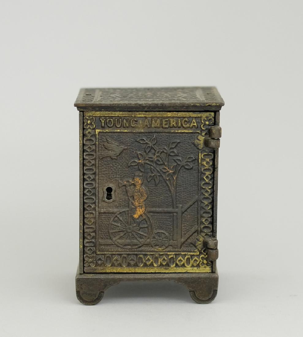 Young America Safe: Made by Kyser & Rex circa 1882. Made of Cast Iron. 4 3/8" Tall. Very Fine Condition.