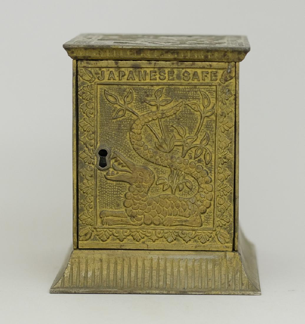 Japanese Safe: Made by Kyser & Rex circa 1882. Made of Cast Iron. 3 1/2" Tall. Fine Condition (Some red paint added in the day).