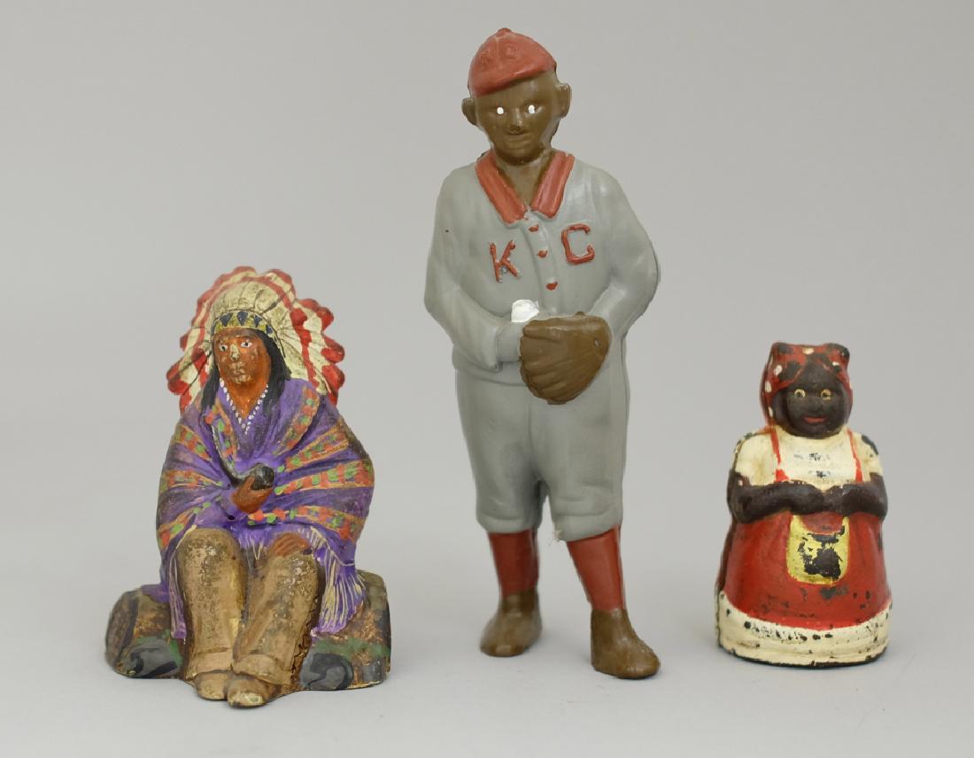 Three Figural Banks: Various Makers. All made of Cast Iron. Indian / Mammy are Modern. Baseball player for the SBCCA 2007 Convention. In Very Fine to Pristine Condition.