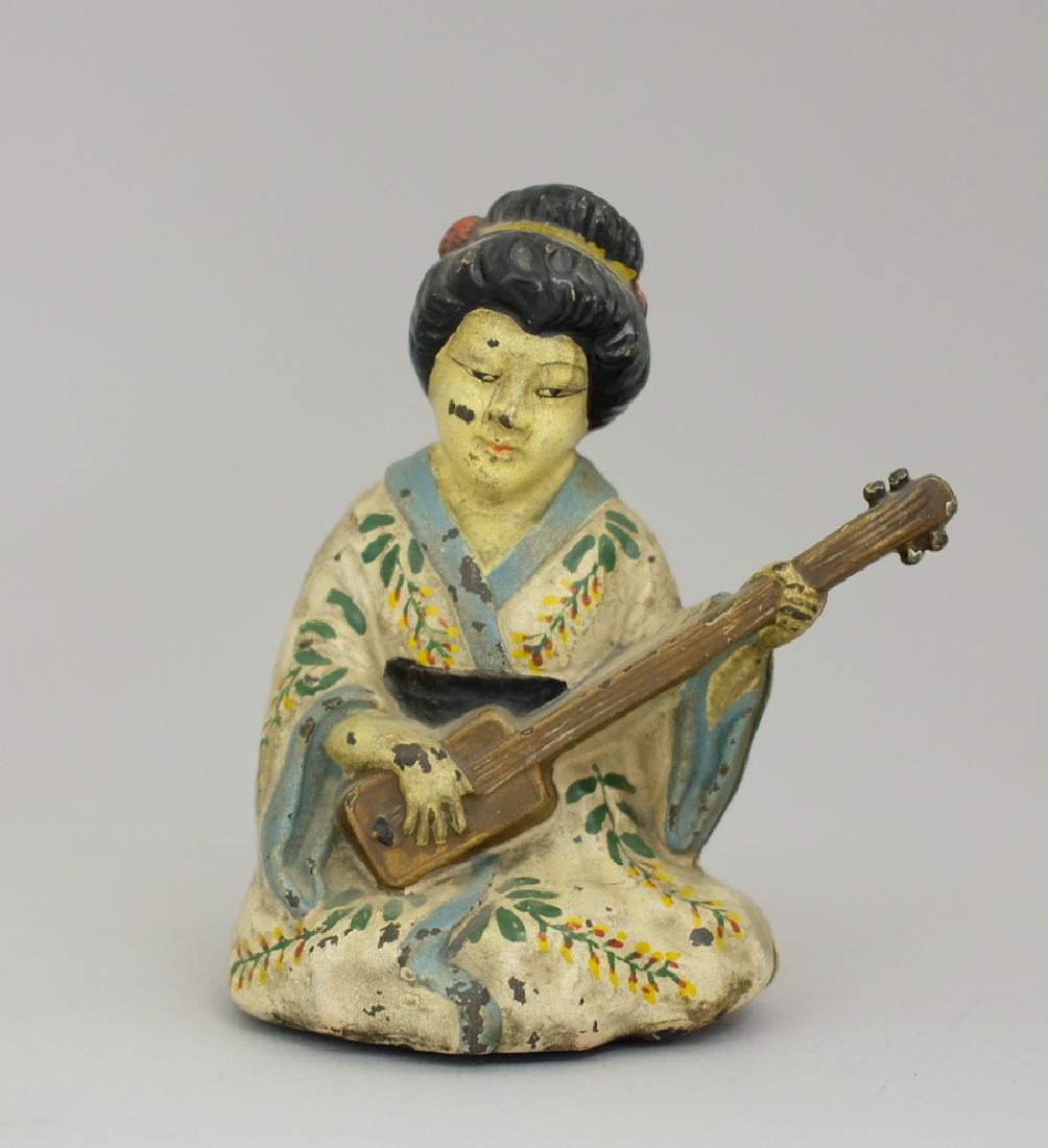 Benten Doorstop: Made by Hubley circa 1930's. Made of Cast Iron. 5 9/16" Tall. Excellent Condition.
