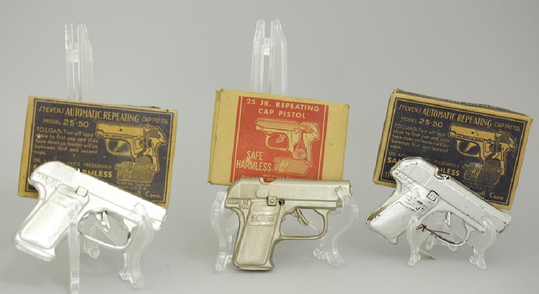 Two Automatic Repeating /One Jr. Repeating Cap Gun: Made by J. & E. Stevens. Made of Cast Iron. Pristine Condition in Original Boxes.