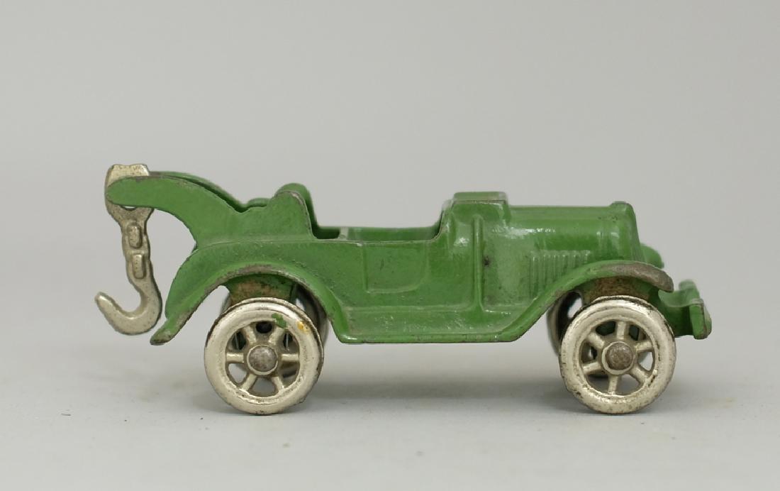 Tow Truck Cast Iron Toy: Made by Hubley circa 1920's. Made of Cast Iron. 5" Long. Excellent Condition.